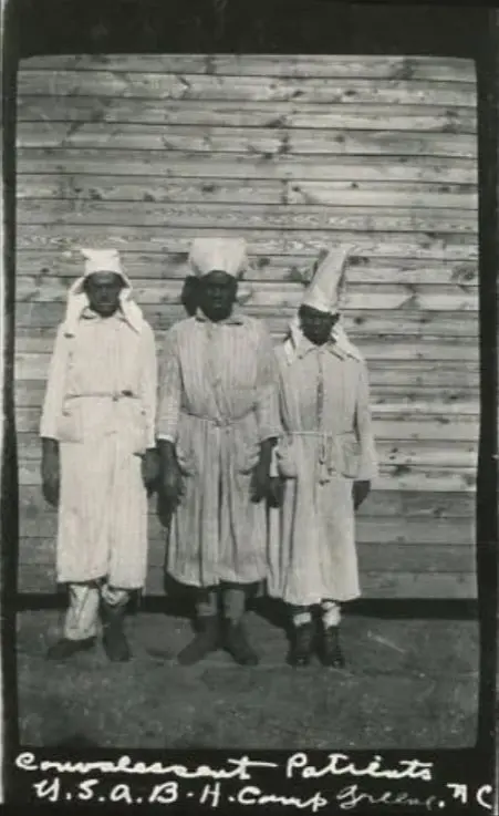 An undated photo of three Black convalescent patients outside of Base Hospital at Camp Greene.
