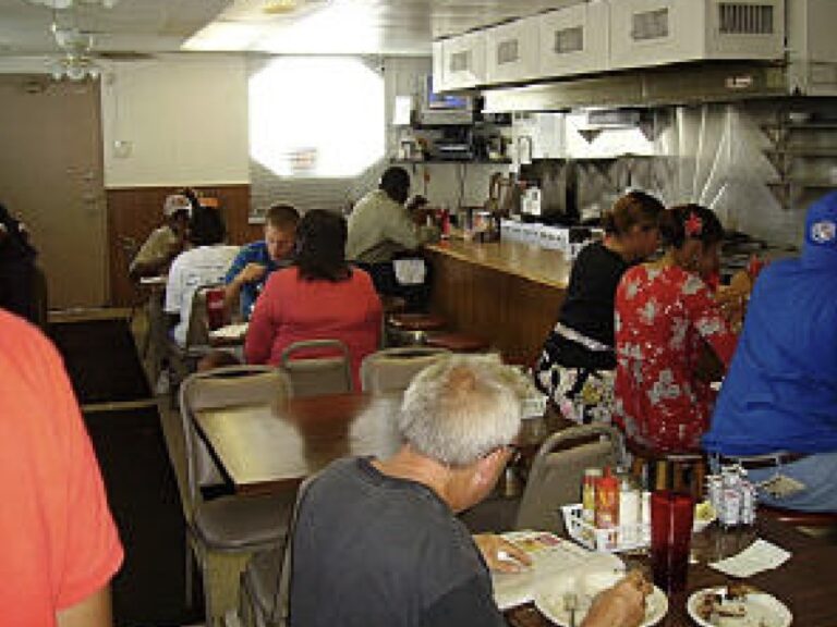 A photo of patrons eating at the Coffee Cup.
