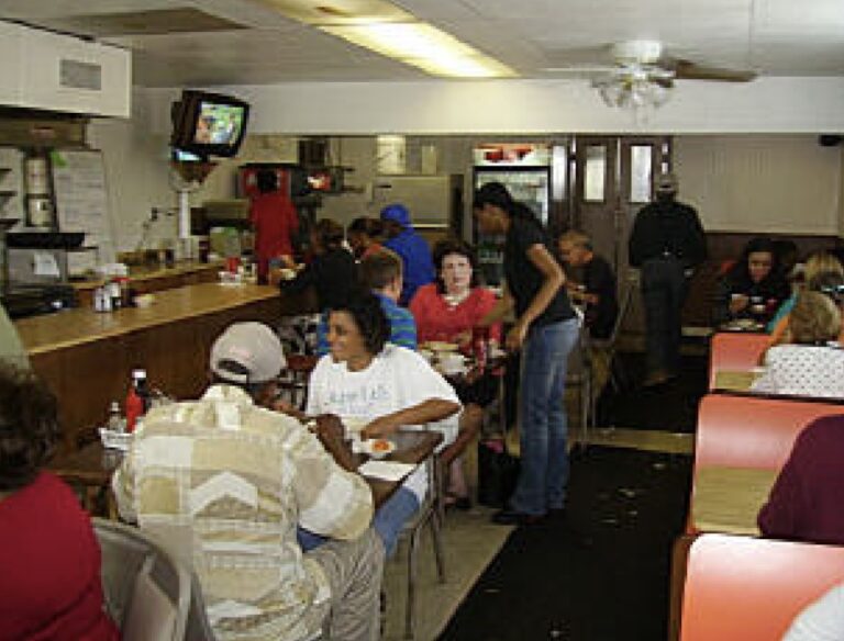 A photo of patrons eating at the Coffee Cup.