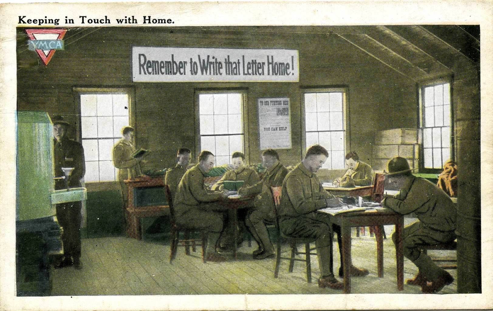 A postcard showing soldiers writing letter back home.