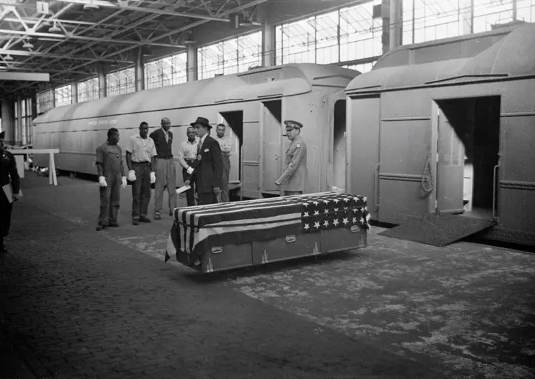An image of a soldier’s coffin returning home.