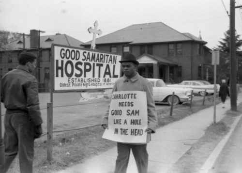 A photo of protestors outside of Good Samaritan during the Civil Rights Movement.