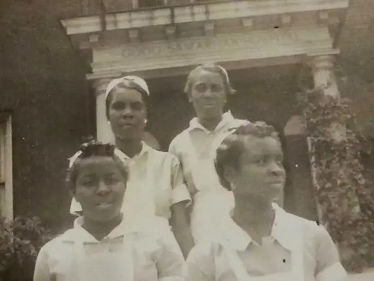 A photo of four nurses standing outside of Good Sam.