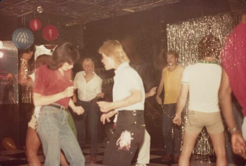 An image of people dancing at night club.