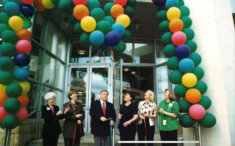 An image of the ribbon cutting for the Levine Museum of the New South in 2001.