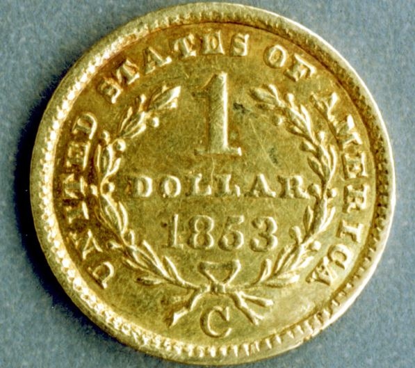 An image of a $1 gold piece.