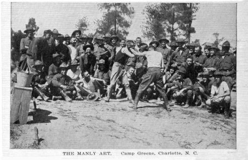 A postcard showing two soldiers boxing at Camp.