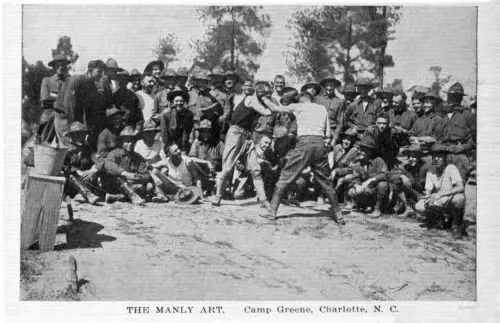 A postcard showing two soldiers boxing at Camp.