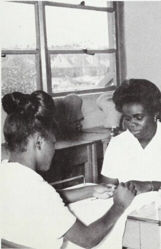 A photo of the manicuring class at West Charlotte High School, one student is practicing what she’s learned.