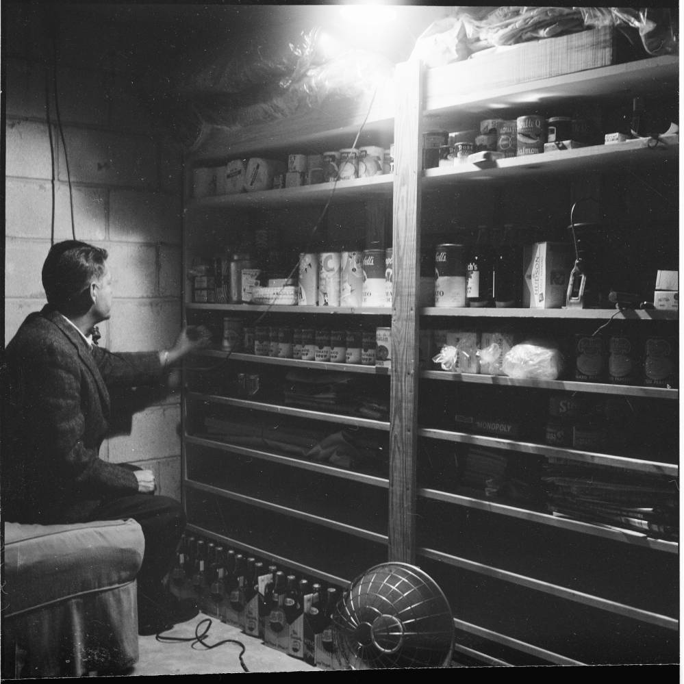 Photograph of a man in a North Carolina nuclear fallout shelter