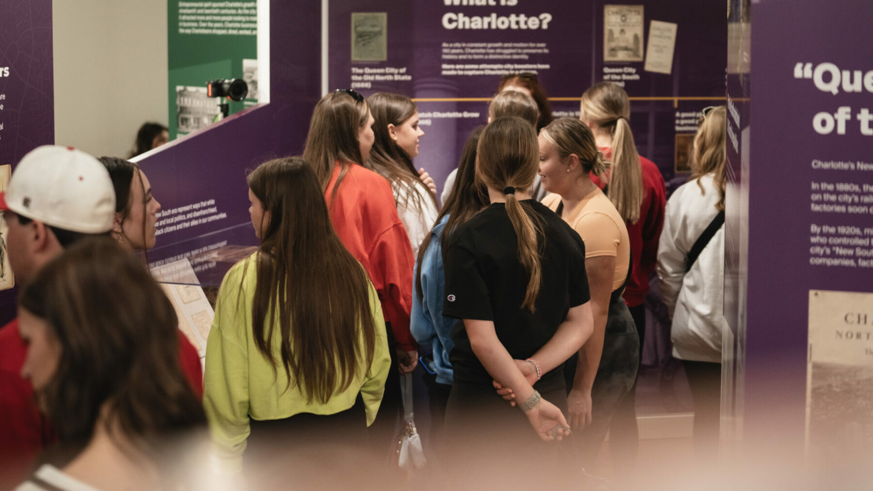 Group of people surrounding by exhibitions