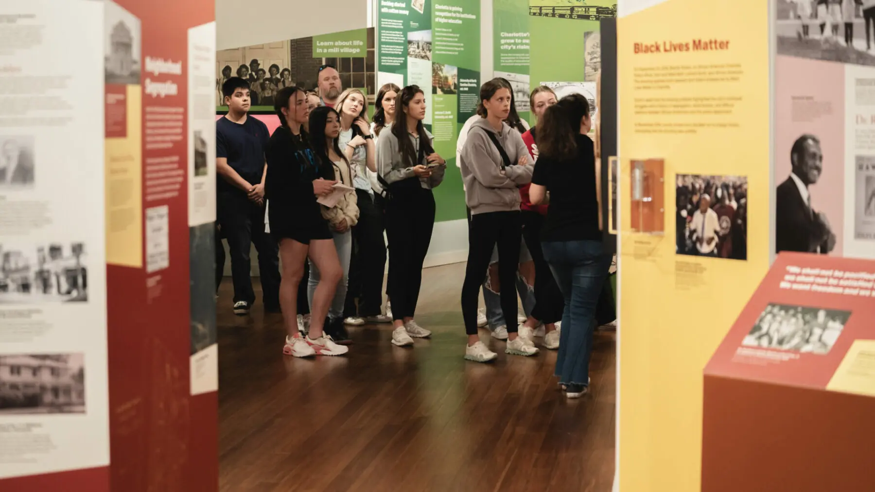 Group of young people surrounded by exhibits at Levine Museum of the New South