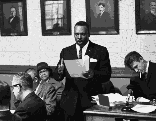 Photograph of Kelly Alexander, Sr. leading a meeting
