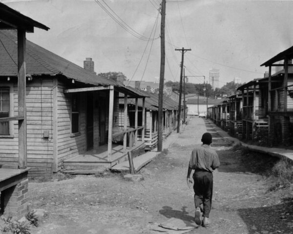 An image of child walking down a road.